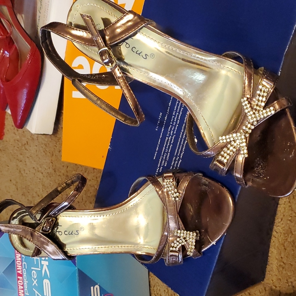 Broken rhinestone on left shoes